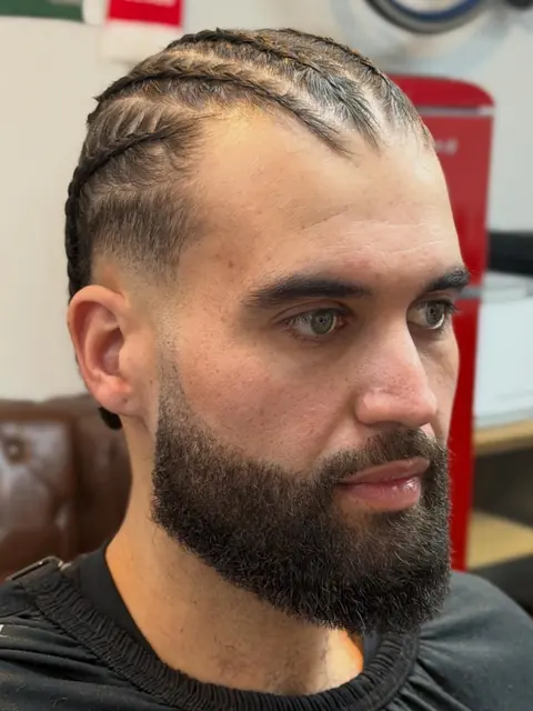 Braids with a full beard, edges lined up