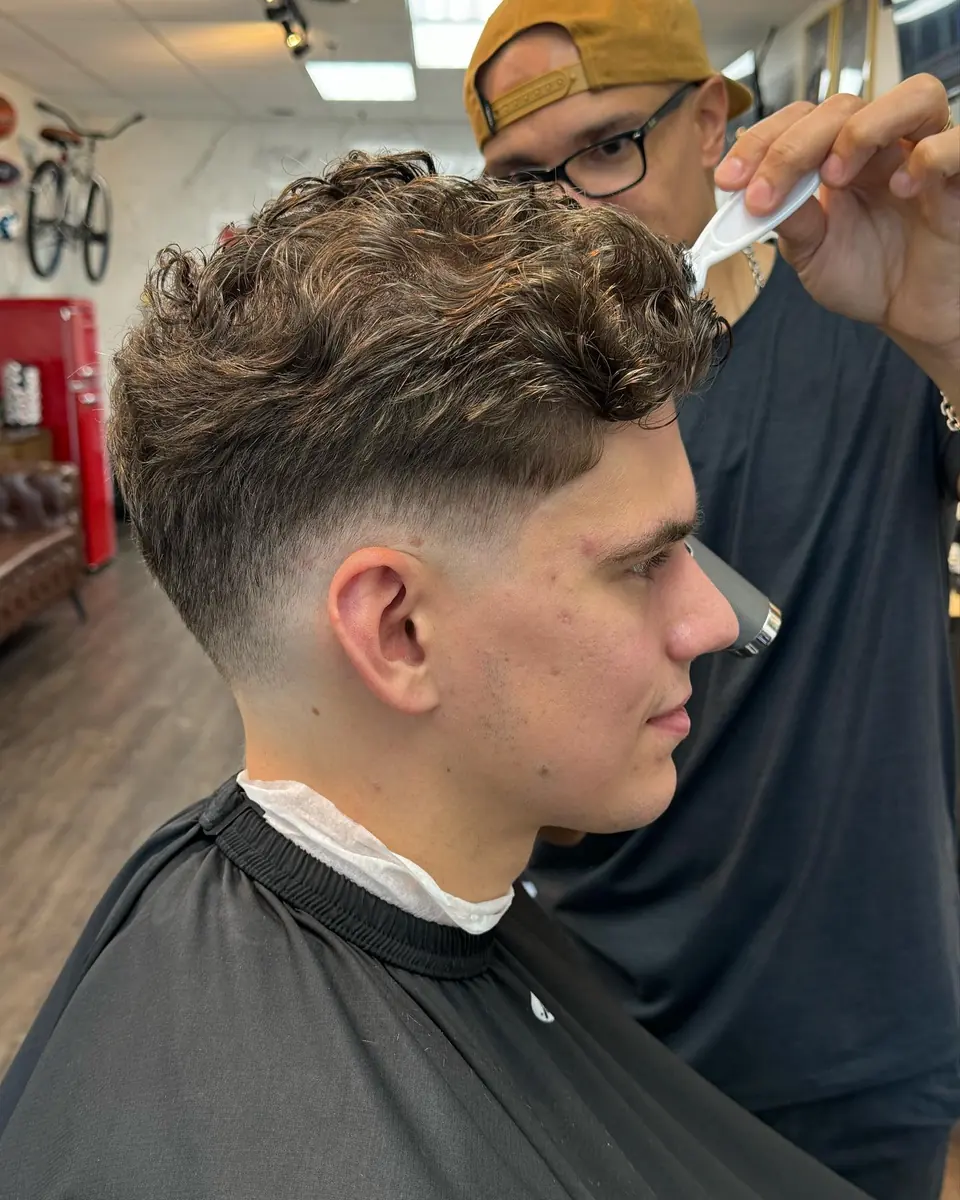 Loose curly top with a taper
