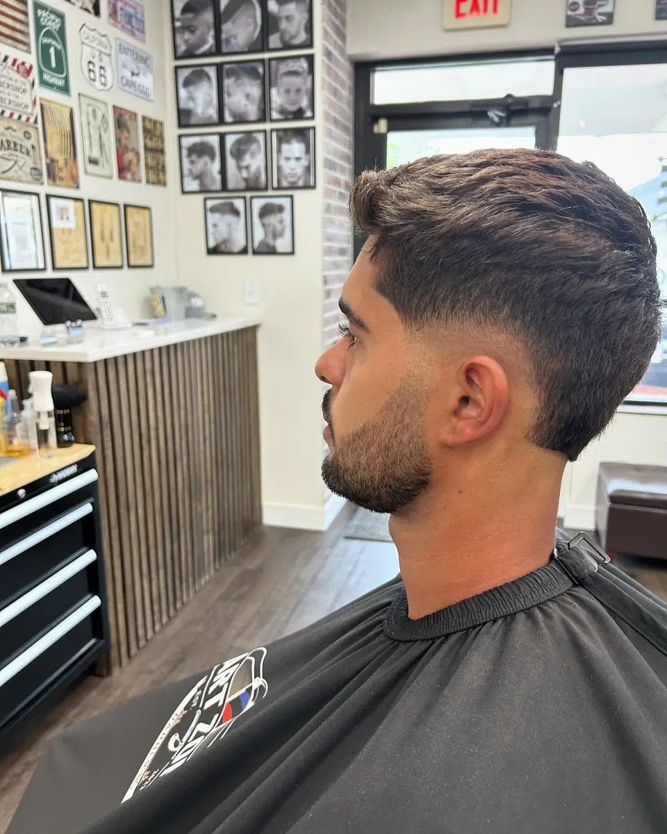 Fade with a groomed beard, side profile