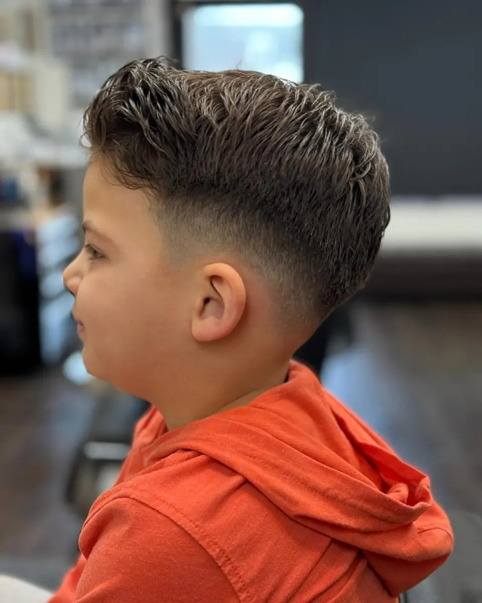 A young boy's taper with a textured top