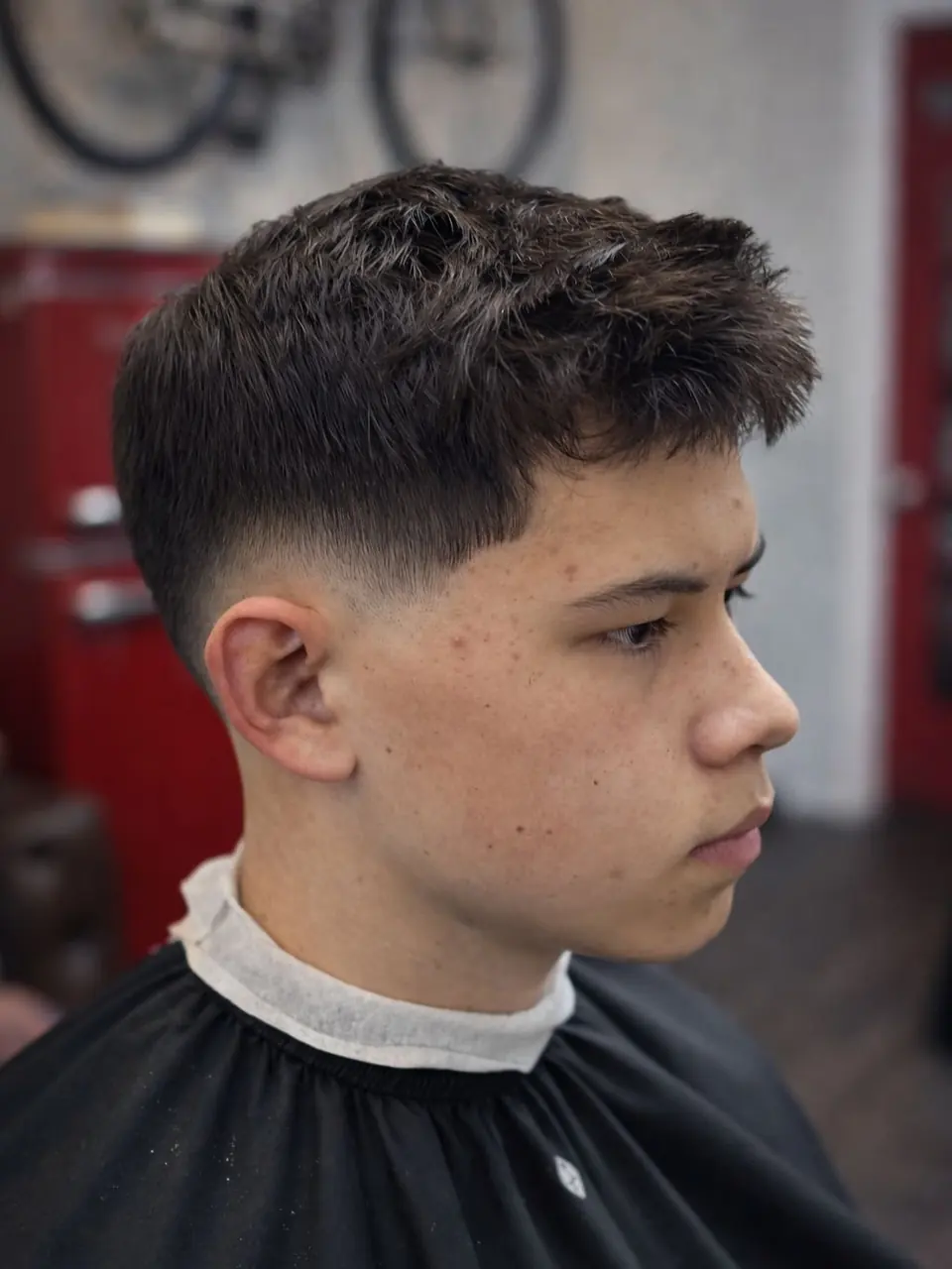 Low fade with a textured fringe on a teenager